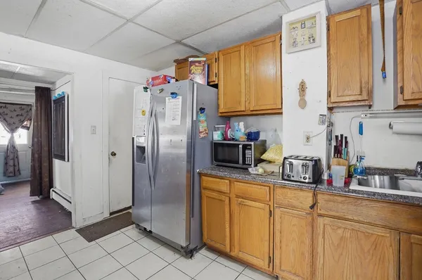 a kitchen with stainless steel appliances a refrigerator sink and cabinets