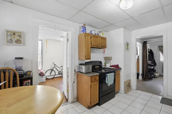a kitchen with a sink appliances and cabinets