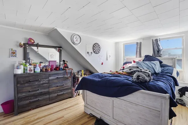 a bed room with a bed and a window