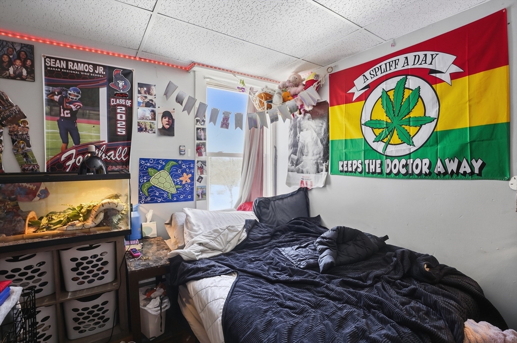 52-56 Green Street Athol, MA 01331 - Photo 23 of 41 a bed sitting in a bedroom next to a window