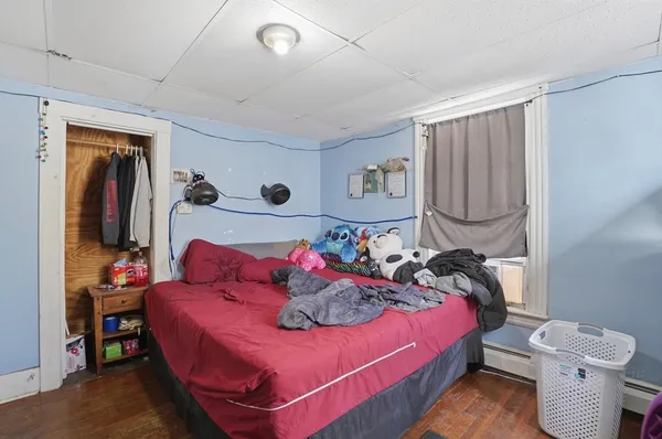 a bedroom with a bed and furniture