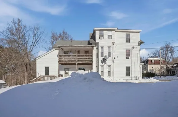 a view of a house with a street