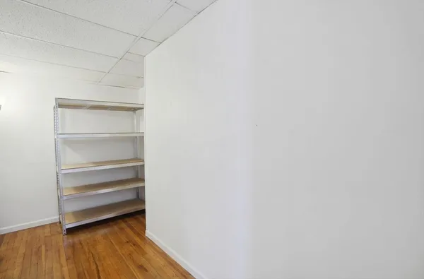 a storage room with wooden floor