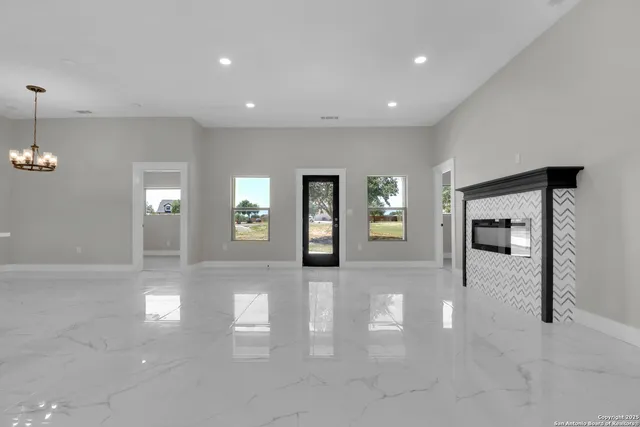 a view of livingroom with hardwood floor and fireplace