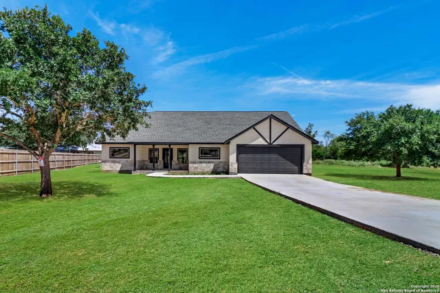 a house view with a garden space
