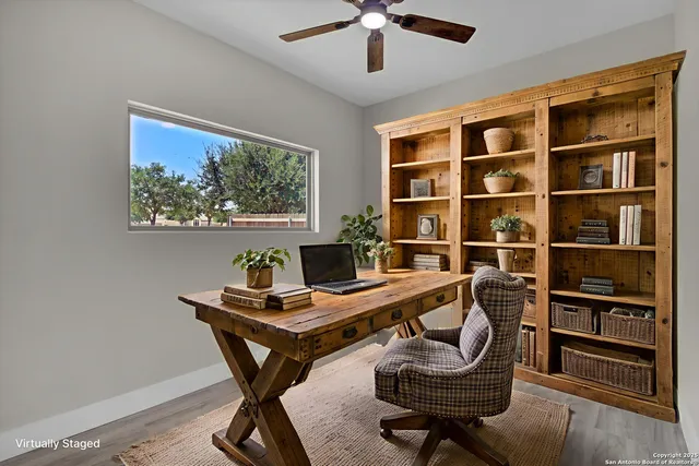 a workspace with furniture and a window