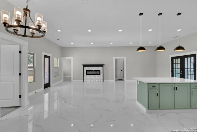 a view of lobby with furniture and chandelier