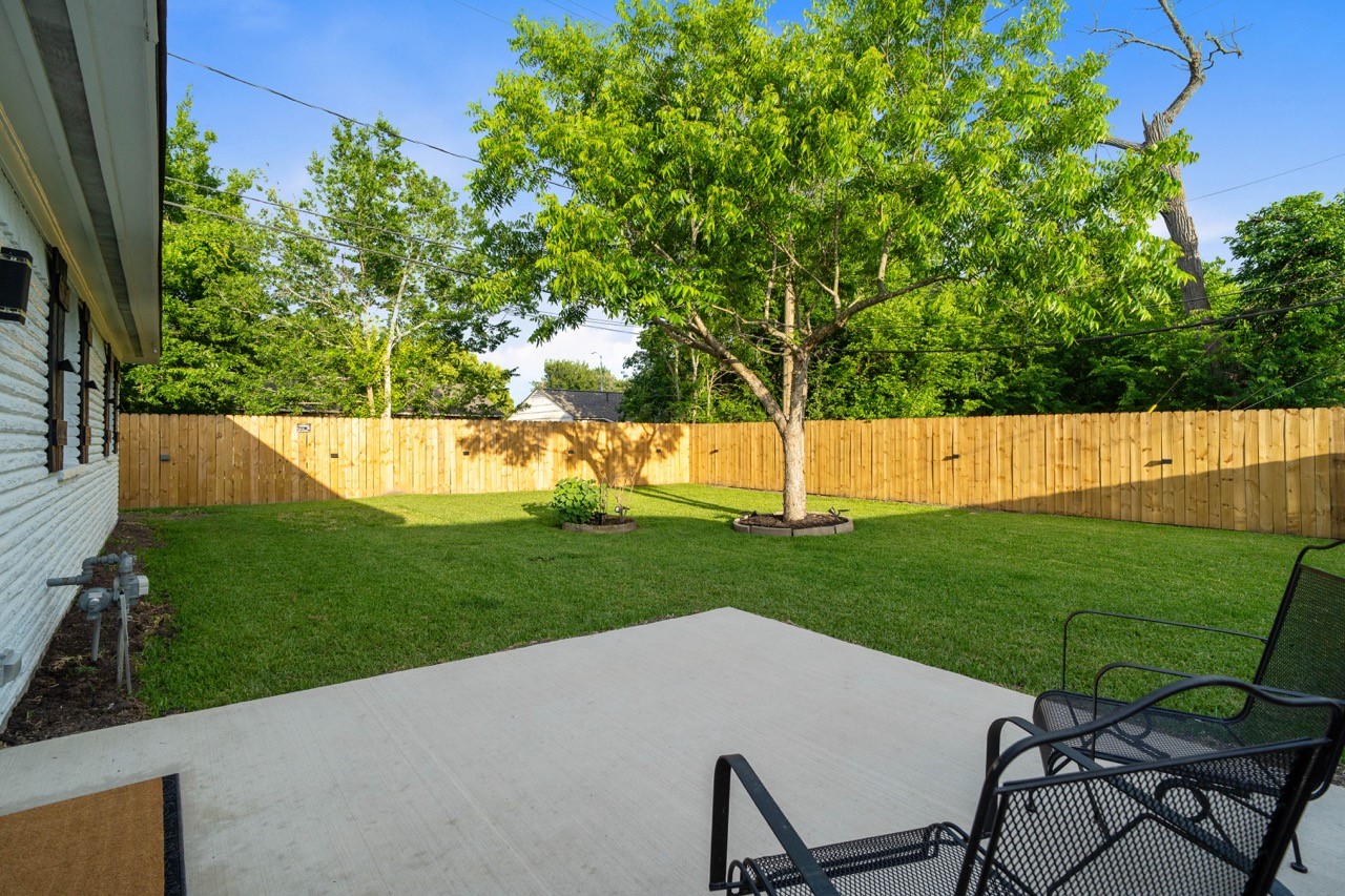 3138 Sunbeam Street Houston, TX 77051 - Photo 39 of 50 Step outside to a spacious fenced backyard with lush green space and a clean palette ready for your touch - perfect for entertaining, relaxing, or weekend gatherings.