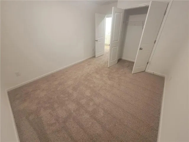 a view of a bathroom from a hallway