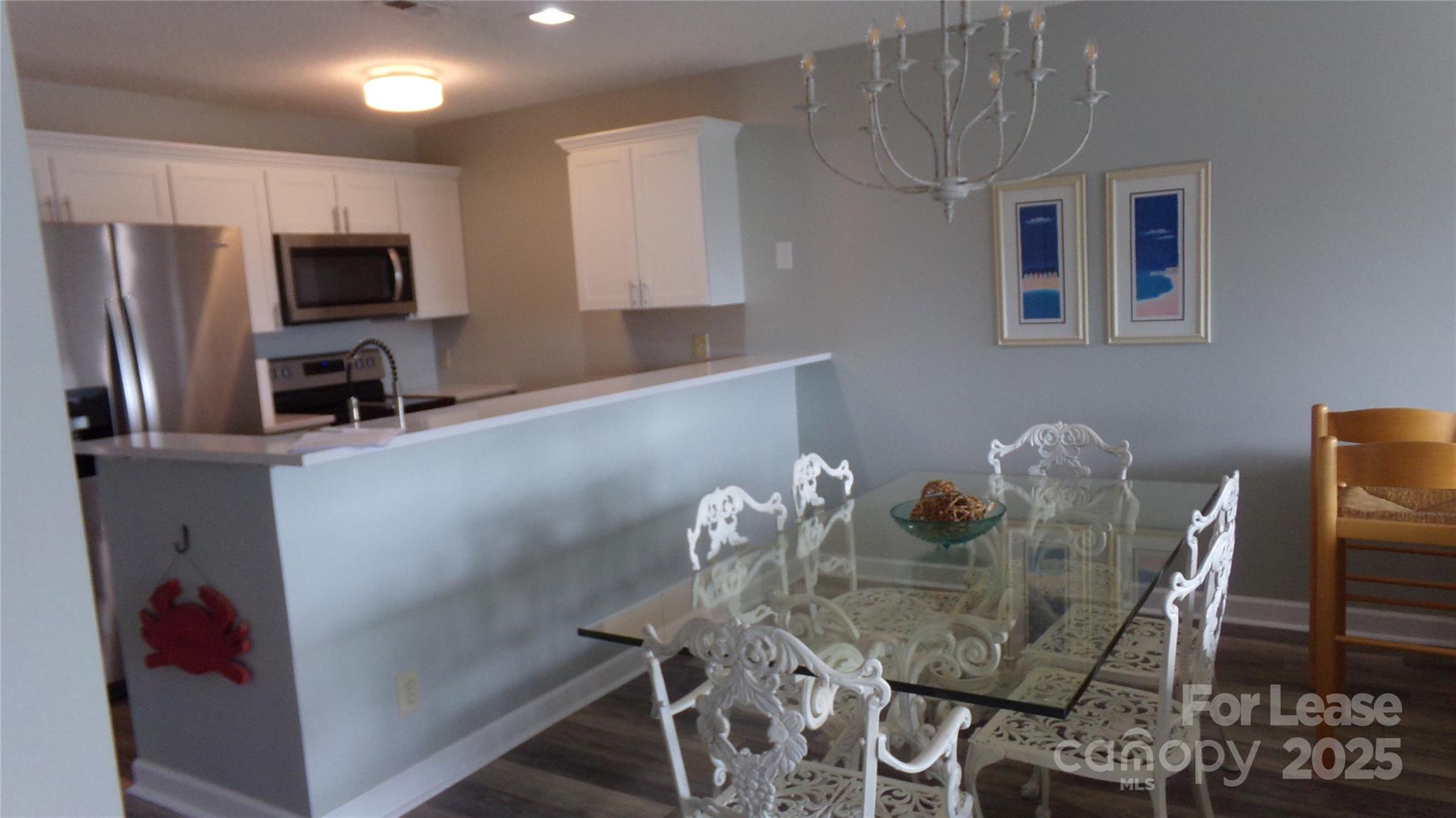 17919 Kings Point Drive, Unit E Cornelius, NC 28031 - Photo 11 of 30 a dining room with furniture and window