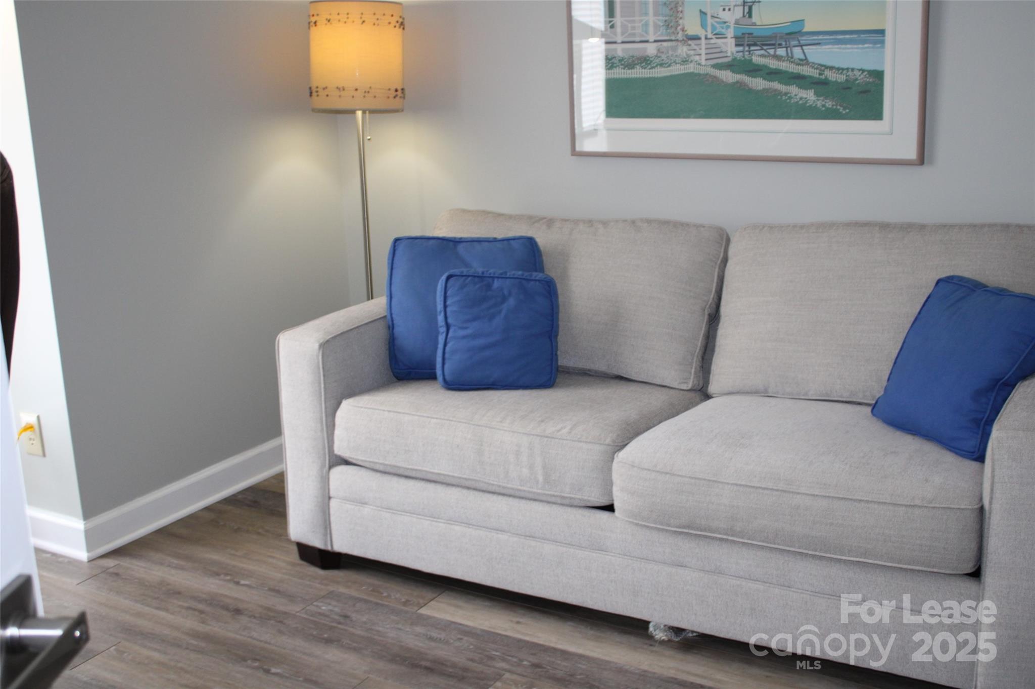 17919 Kings Point Drive, Unit E Cornelius, NC 28031 - Photo 20 of 30 a living room with furniture and a window