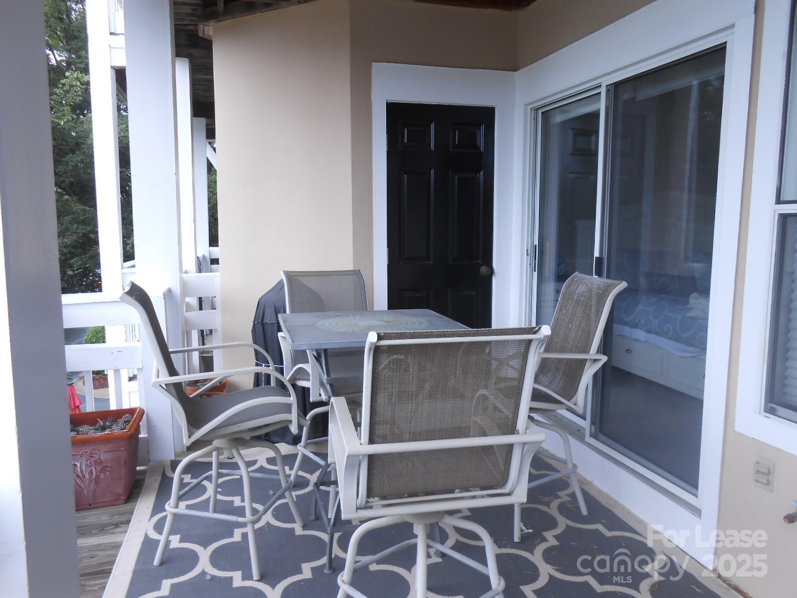 17919 Kings Point Drive, Unit E Cornelius, NC 28031 - Photo 23 of 30 a view of a dining room with furniture