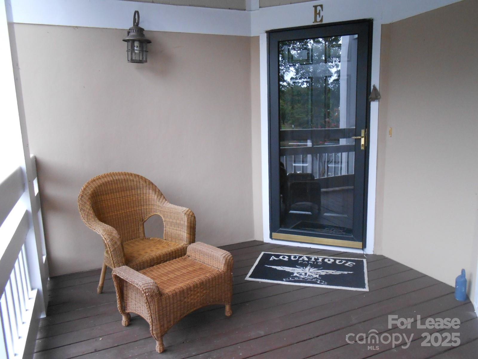 17919 Kings Point Drive, Unit E Cornelius, NC 28031 - Photo 28 of 30 a view of a door and chair in a room