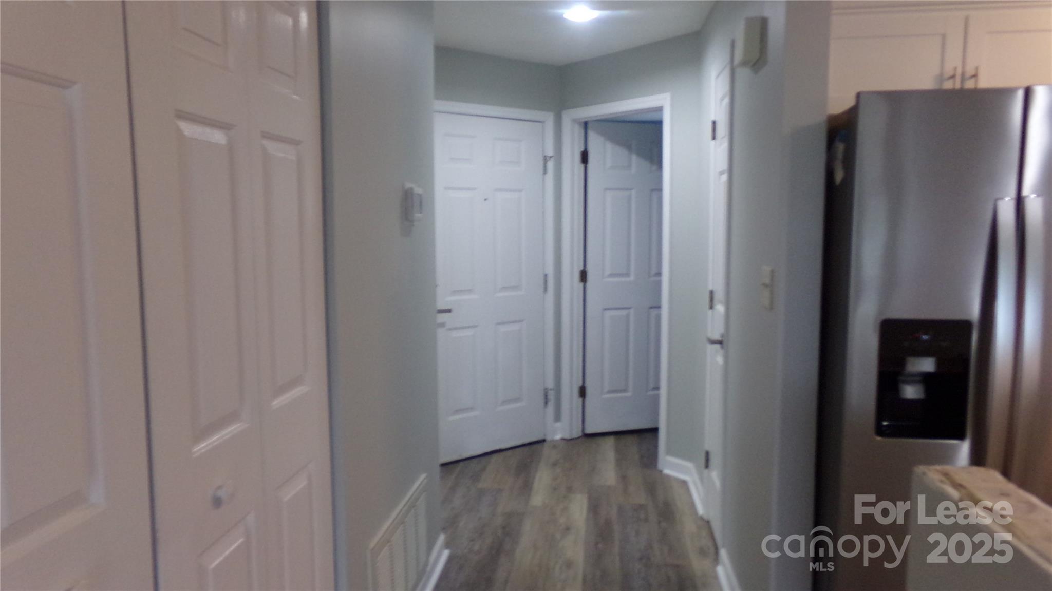 17919 Kings Point Drive, Unit E Cornelius, NC 28031 - Photo 7 of 30 a view of a refrigerator in kitchen and entryway