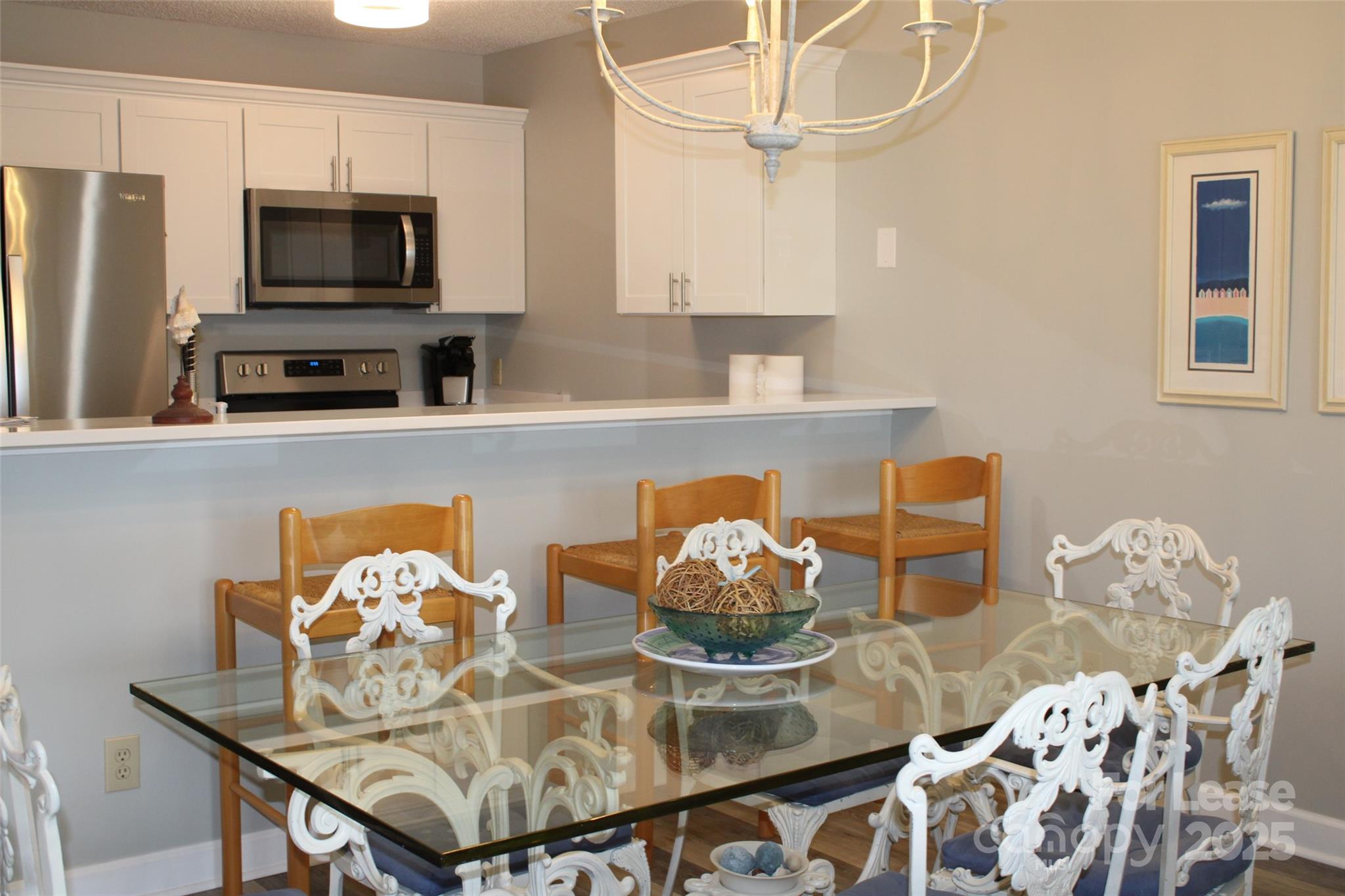 17919 Kings Point Drive, Unit E Cornelius, NC 28031 - Photo 8 of 30 a living room with furniture and a flat screen tv