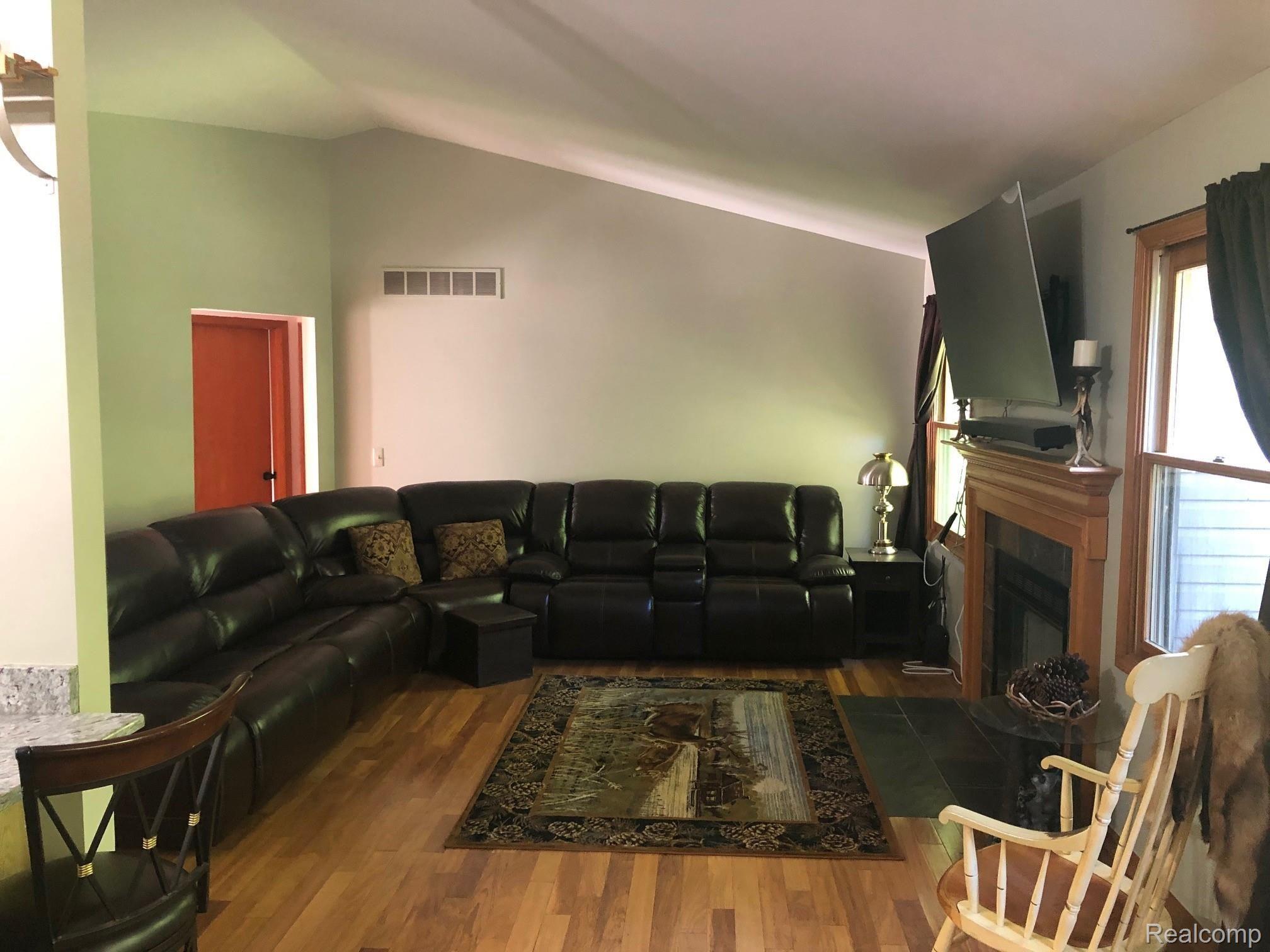 14385 Hess Road Holly, MI 48442 - Photo 3 of 29 Hardwood great room with vaulted ceiling