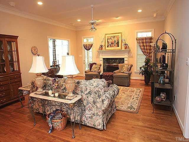 6509 Arbor Grande Way Raleigh, NC 27615 - Photo 2 of 12 Great room with gas logs, hardwood floors, recessed lighting, crown moldings Den/Family/Great Room