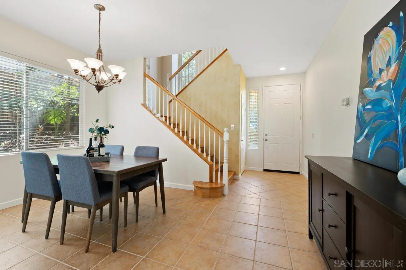 614 Compass Court Carlsbad, CA 92011 - Photo 11 of 33 a view of a dining room with furniture and a chandelier
