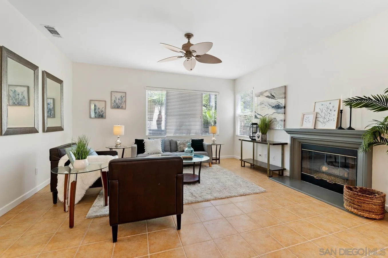 614 Compass Court Carlsbad, CA 92011 - Photo 14 of 33 a living room with furniture a fireplace and a window