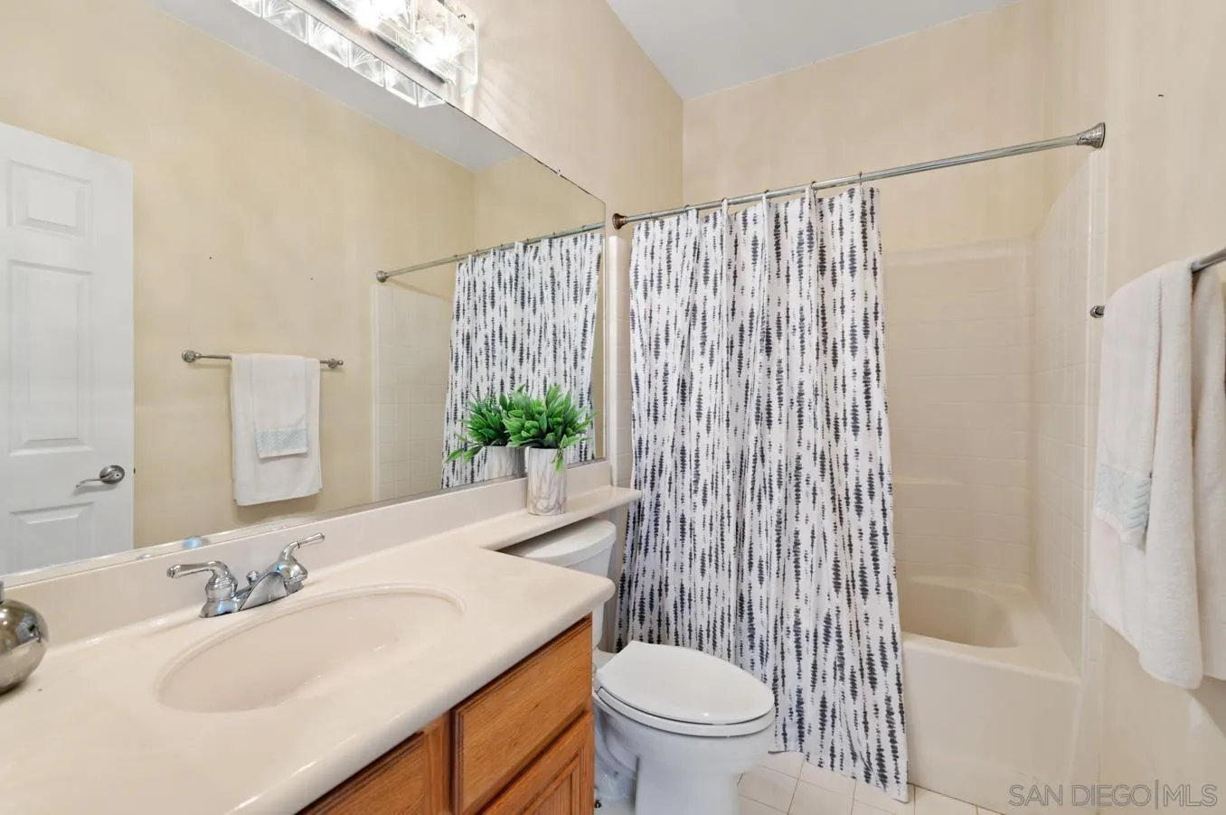614 Compass Court Carlsbad, CA 92011 - Photo 23 of 33 a bathroom with a sink toilet and shower
