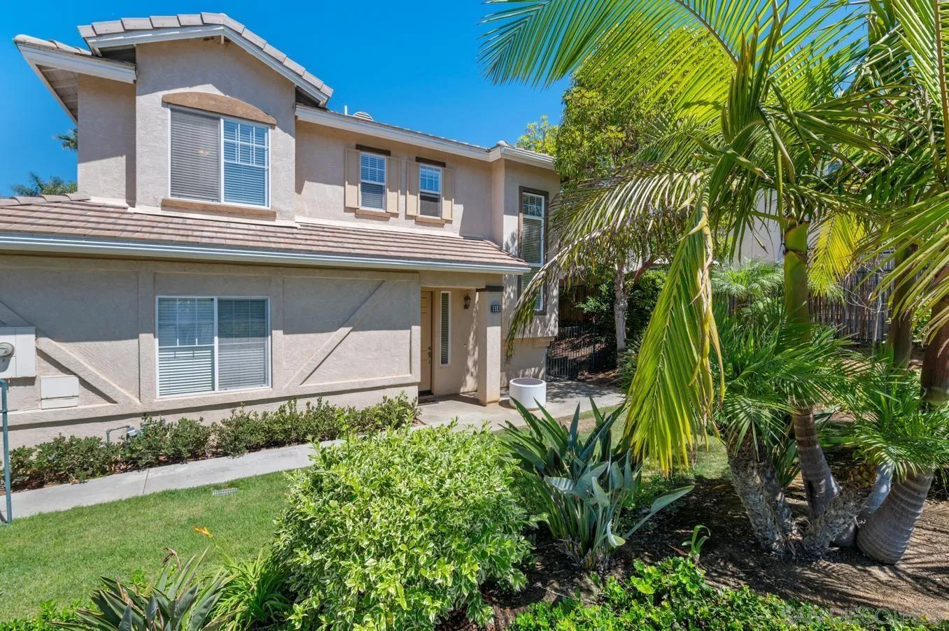 614 Compass Court Carlsbad, CA 92011 - Photo 4 of 33 a house view with a garden space