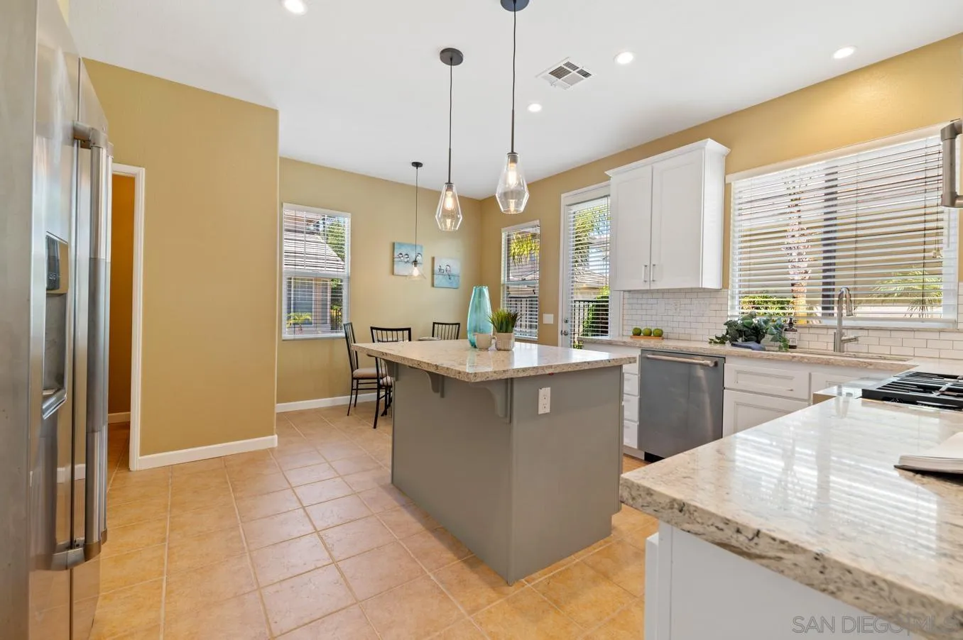 614 Compass Court Carlsbad, CA 92011 - Photo 8 of 33 a kitchen with a sink a counter top space and appliances