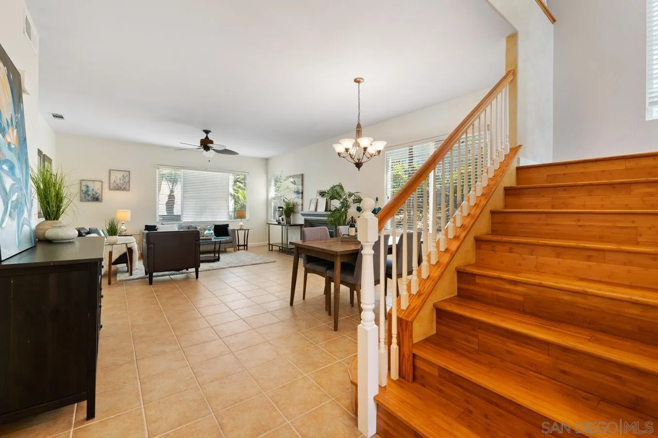 614 Compass Court Carlsbad, CA 92011 - Photo 10 of 33 a livingroom with furniture staircase and a chandelier