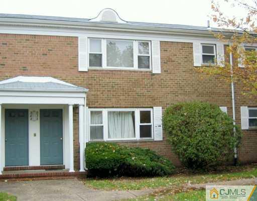 199 Evergreen Road, Unit 3A Edison, NJ 08837 - Photo 1 of 6 a view of a brick house with plants