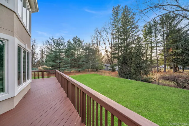 a view of balcony and yard