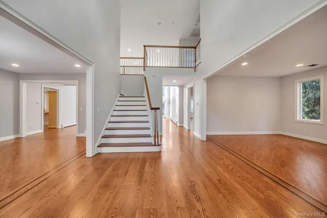 a view of entryway with wooden floor