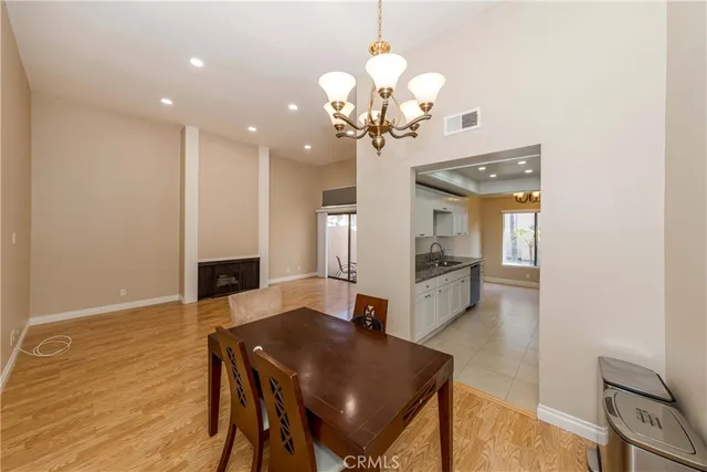 a large kitchen with stainless steel appliances granite countertop a stove a sink and a granite counter tops