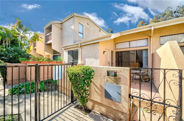 a view front of house with a potted plant