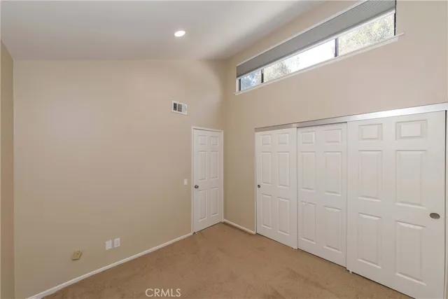 a view of a hallway with closet