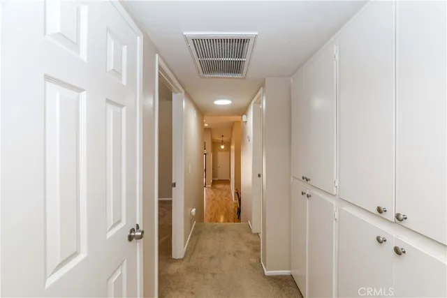 an empty room with a empty space and windows