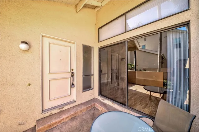 a bathroom with a granite countertop sink mirror vanity and toilet