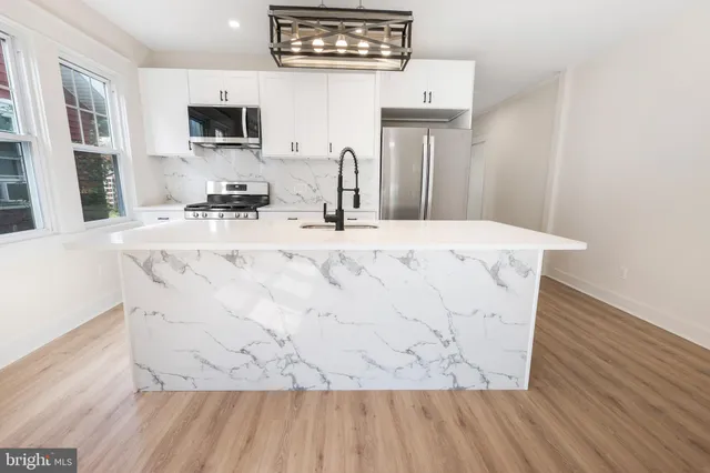 a view of living room with furniture and flat screen tv