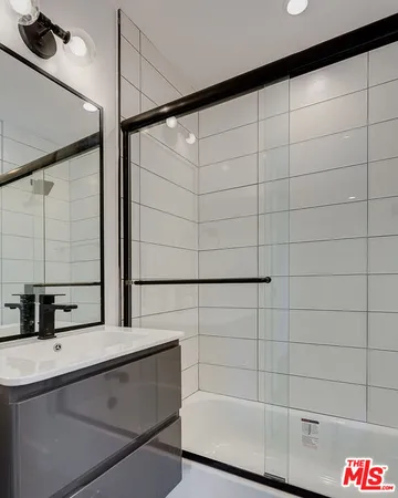 a bathroom with a sink and a shower