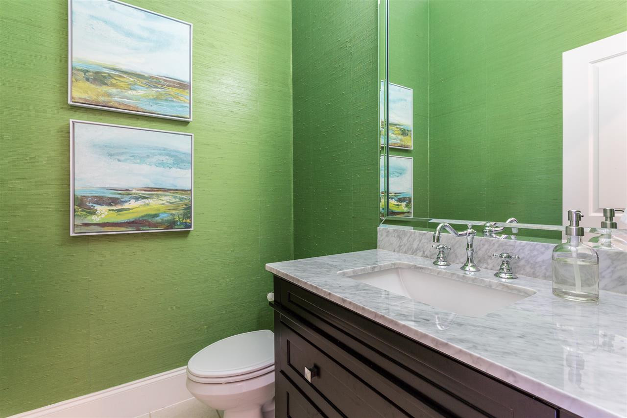1716 Stannard Trail Raleigh, NC 27612 - Photo 12 of 30 Kelly green grass cloth creates a powder room that is bright and beautiful. The powder room features an updated bath vanity with a granite counter top. Updated 1st Floor Powder Room