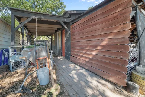 a view of a patio with table and chairs and potted plants
