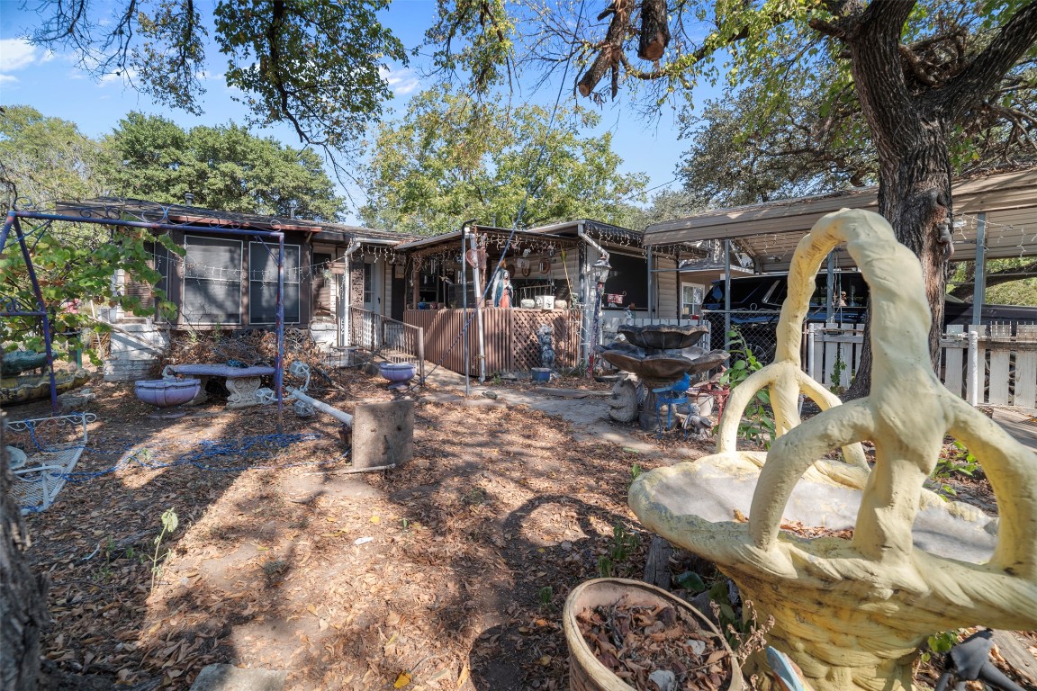 800 Vargas Road Austin, TX 78741 - Photo 17 of 19 a view of backyard with table and chairs and a barbeque