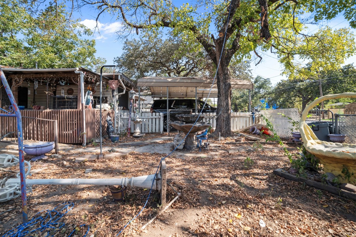 800 Vargas Road Austin, TX 78741 - Photo 19 of 19 a view of a patio with table and chairs next to a yard