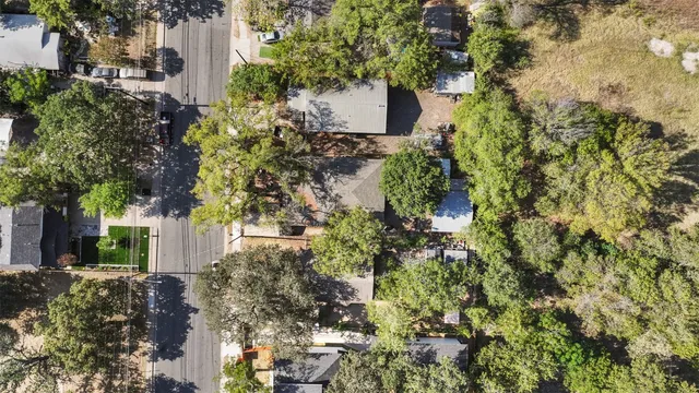 an aerial view of a house with a swimming pool