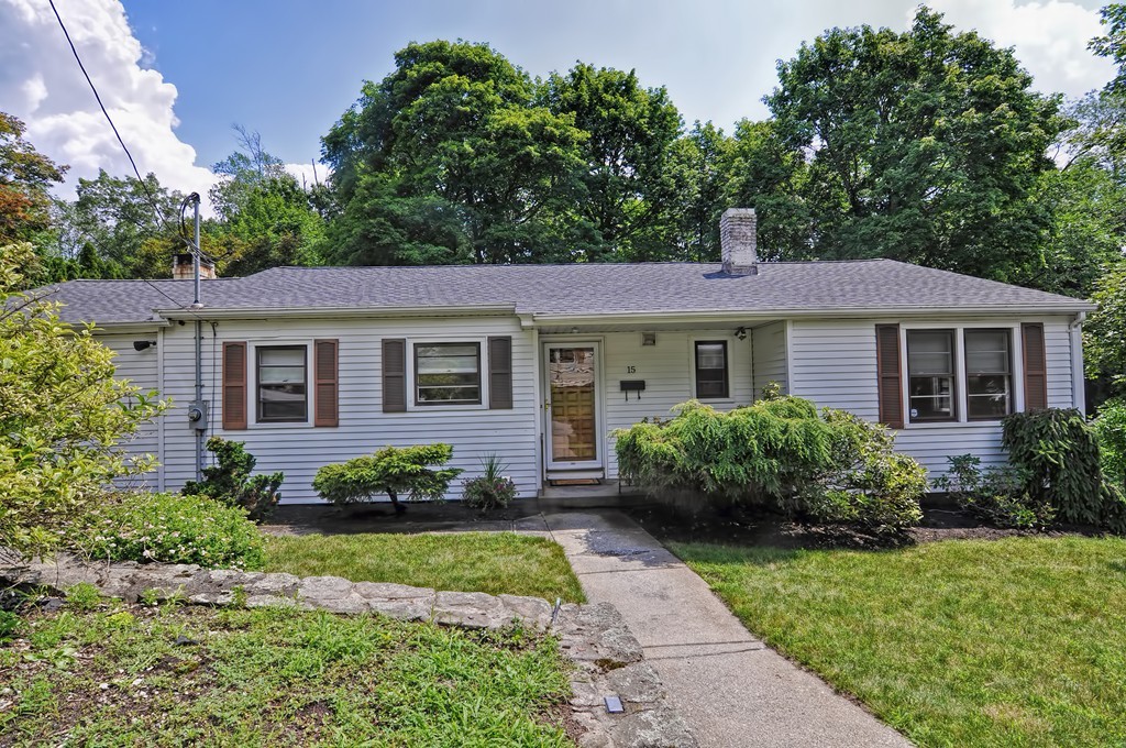 a front view of a house with a garden and porch
