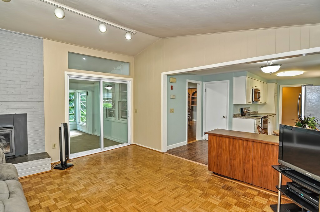 15 Rydal Street Worcester, MA 01602 - Photo 11 of 29 a view of a livingroom with wooden floor and a fireplace