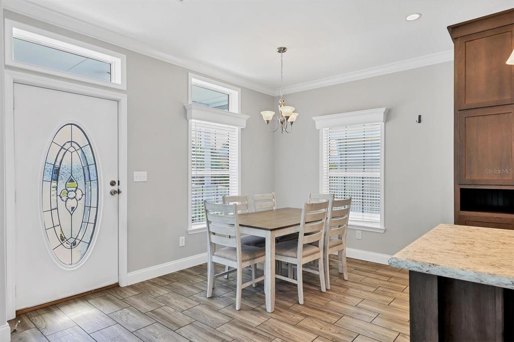 3607 70th Avenue East Ellenton, FL 34222 - Photo 16 of 43 a view of a dining room with furniture and chandelier