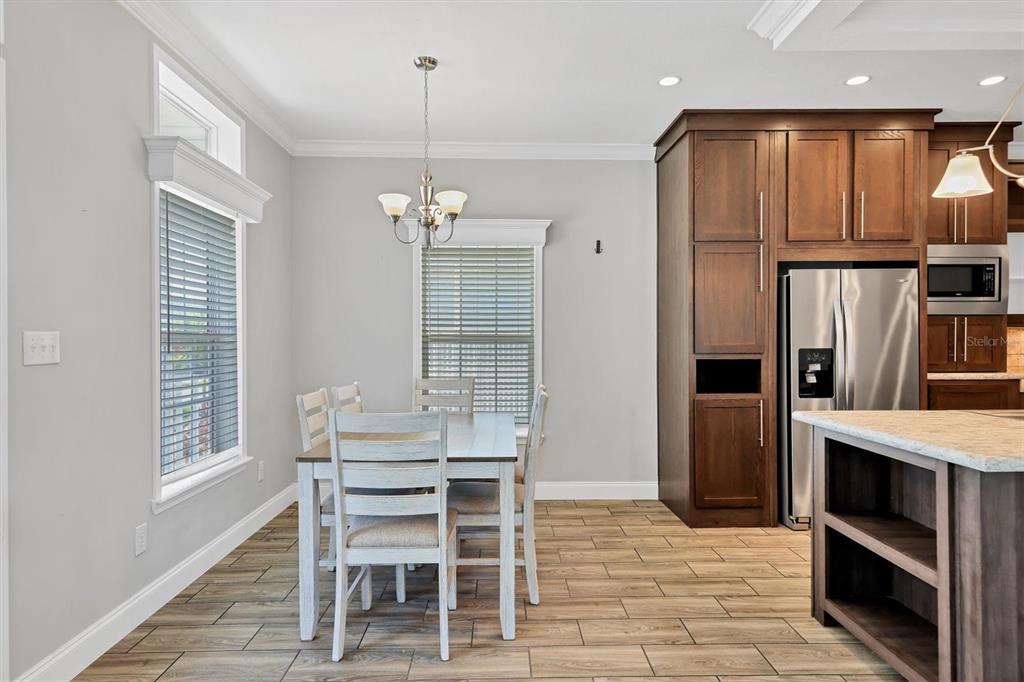 3607 70th Avenue East Ellenton, FL 34222 - Photo 17 of 43 a dining room with furniture and window