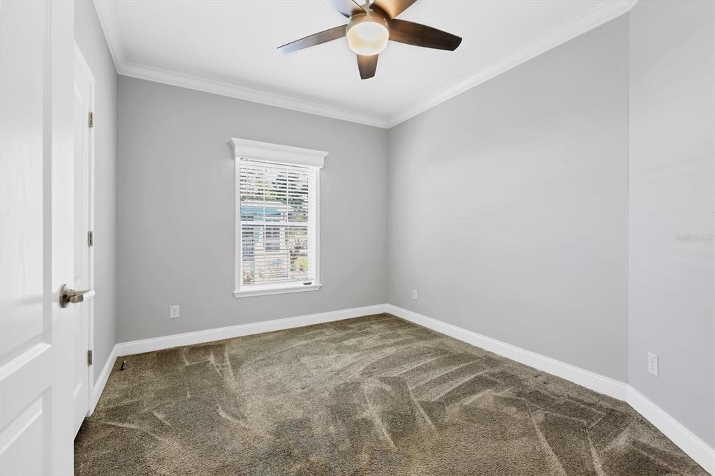 3607 70th Avenue East Ellenton, FL 34222 - Photo 23 of 43 an empty room with a window and a fan