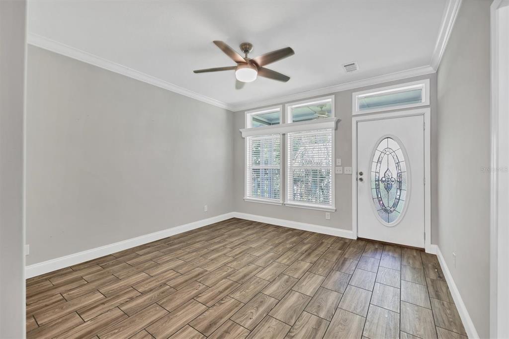 3607 70th Avenue East Ellenton, FL 34222 - Photo 25 of 43 a view of empty room with wooden floor and fan