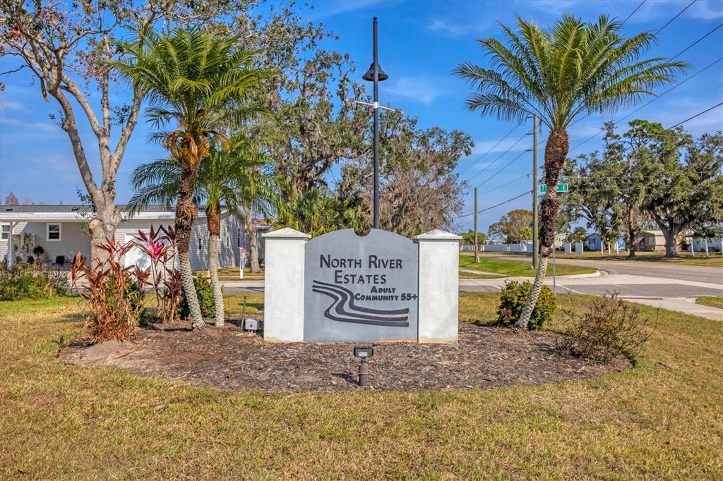 3607 70th Avenue East Ellenton, FL 34222 - Photo 31 of 43 a view of a street with sign board