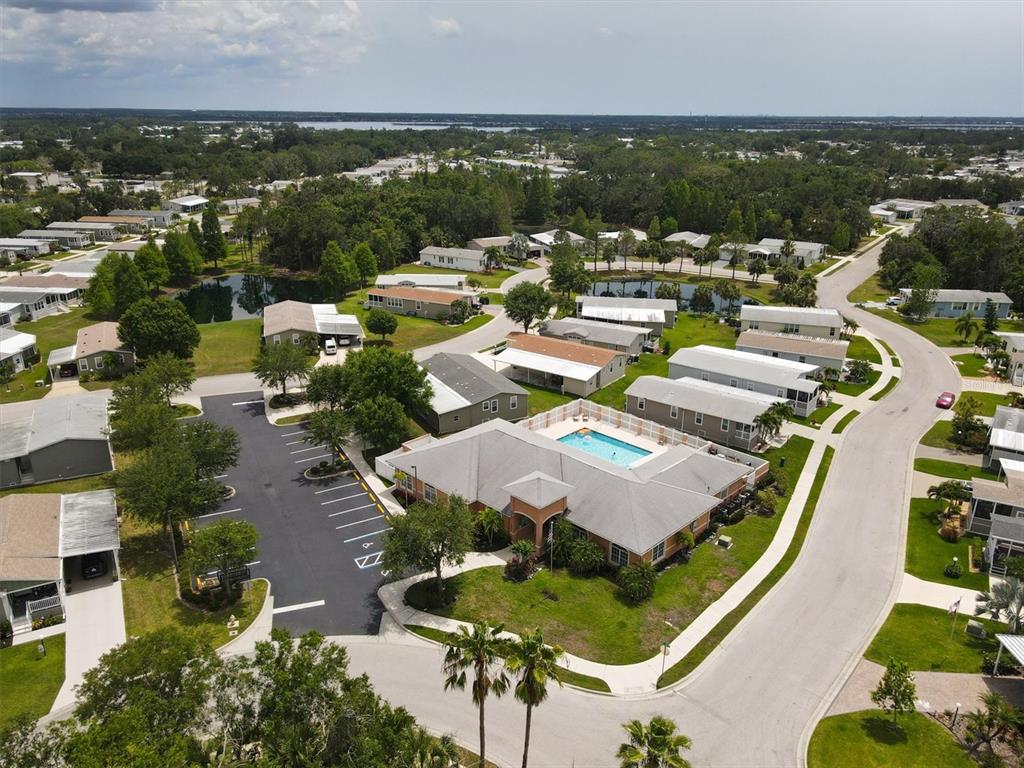 3607 70th Avenue East Ellenton, FL 34222 - Photo 32 of 43 an aerial view of a house with lots of residential buildings ocean and mountain view in back